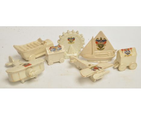 A collection of seven pieces of crested china including Arcadian gypsy caravan, a Willow Art monoplane (af), a Shelley china 