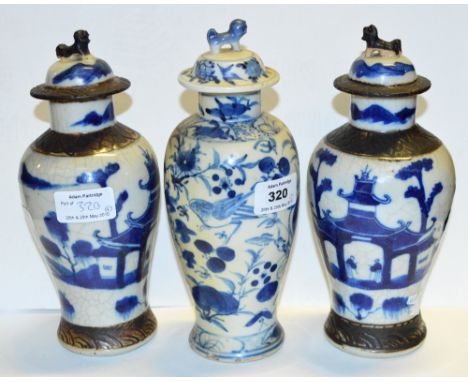 A late 19th century Chinese porcelain jar and cover painted in underglaze blue with blossoming prunus, bears underglaze blue 