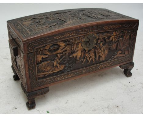 A 20th century carved camphor wood dome topped trunk, width 81cm.
