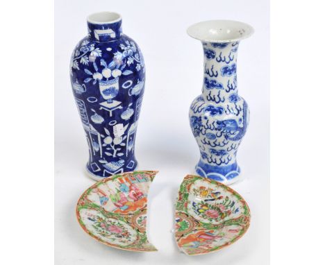 A 19th century Chinese porcelain small Yen Yen vase, painted in underglaze blue with two five clawed confronting dragons chas
