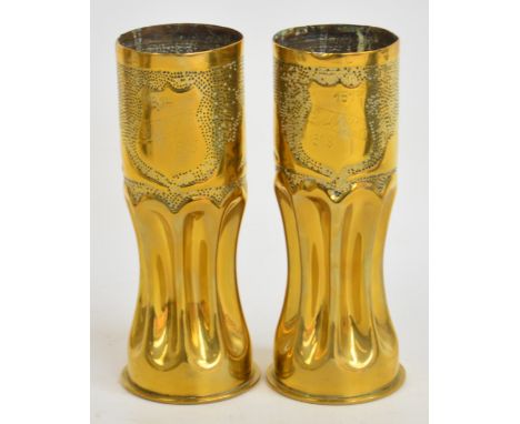 Two brass artillery shell trench art vases decorated with leaves and a shield bearing the inscription "Souvenir 1914-1918", i
