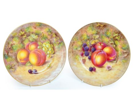 A pair of mid 20th century Royal Worcester porcelain cabinet plates painted with fruit by J Freeman, black printed marks and 