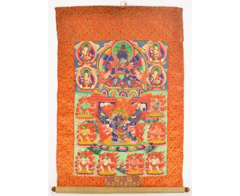 A 19th century Tibetan thangka, centred with Chaturbhujia Mahakala, with skull cup in his front left hand backed by Aureole o