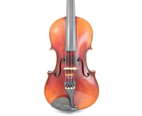 A full size German "Conservatory" violin with two-piece back, Stradivarius copy, length of back 35.8cm, cased with two bows.