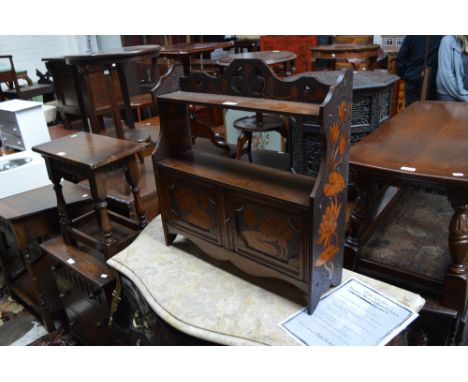An Art Nouveau walnut poker work decorated wall shelf with twin cupboard doors, width 58cm.