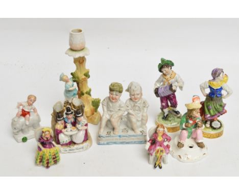 A collection of Continental porcelain figures including a pair by Augustus Rex of a young boy playing a concertina and a youn
