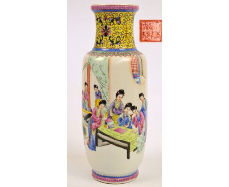 A Chinese Republic porcelain Famille Rose vase painted with robed women in a court scene beneath a band of lotus blooms on a 