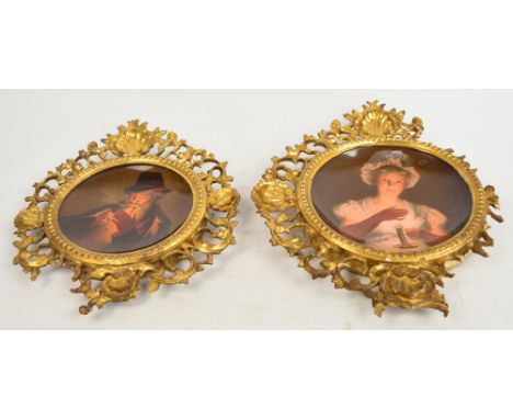 A pair of dished Vienna porcelain plaques, one depicting "Lisette" a charming girl with candlestick and the other "Smoker" a 