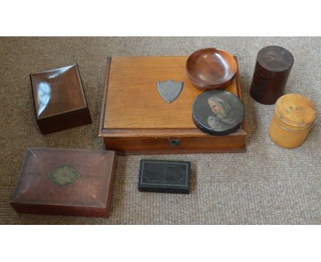 A 19th century papier-mâché circular snuff box, a further rectangular snuff box, an oak trinket box, a small tin, three furth
