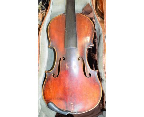 A full size German violin with two-piece back, Stradivarius copy, length 36cm, cased.