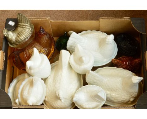 A collection of ceramic and glass chickens on baskets, including a Beswick, model 2298, two large white examples by Portmeiri