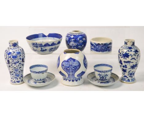 A collection of Chinese blue and white porcelain comprising a Kangxi vase painted with archaic motifs, underglaze blue double