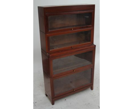 A Globe Wernicke type four section stacking bookcase with up and over glazed doors, width 87cm.