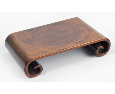 A 19th century Chinese Huali wood one-piece stand with scroll feet, 28 x 17cm. CONDITION REPORT: Rim marks on the top, minor 