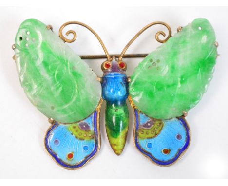 A 1920s Chinese silver, jadeite and enamel brooch, the top wings set with a lightly engraved and pierced green and white vein