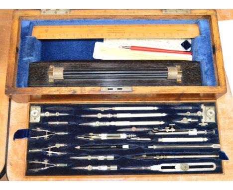 A large Stanley drawing instrument set, in two layers, to include three spring bow compasses, beam compass set, large divider