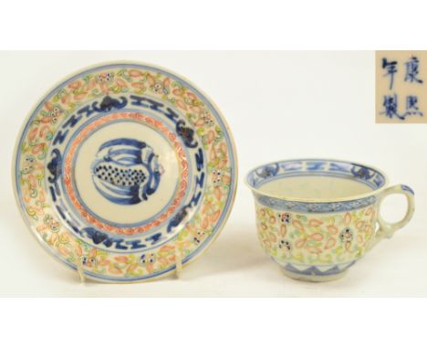 A late 19th century Chinese porcelain rice grain pattern tea cup and saucer, painted in underglaze blue and over glaze polych