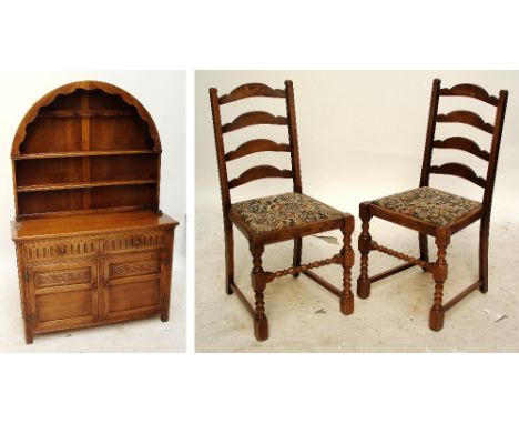 A reproduction oak refectory type table, four ladder back chairs, and a dome topped dresser (6).