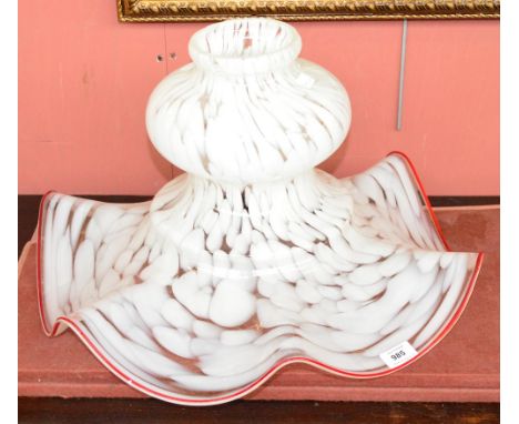 A large early 20th century glass light shade in abstract white and clear pattern, with a red wavy rim, diameter at widest 51.