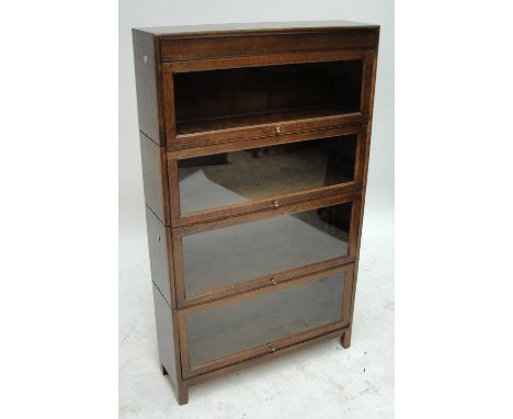 A Globe Wernicke style oak bookcase with horizontally folding glass doors in four component parts, width 86.5cm, height 146cm