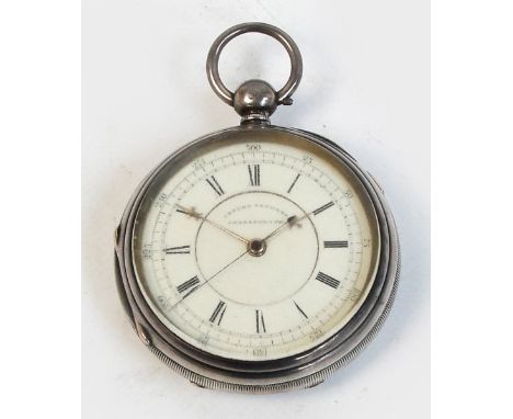 A silver cased open faced key wind "Centre Seconds Chronograph", the case with vacant shield cartouche, the white enamel dial