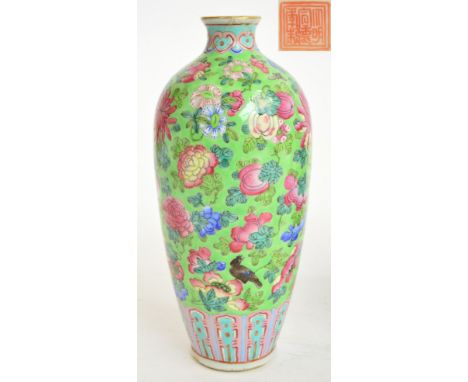 A late 19th century Chinese porcelain baluster vase painted in Famille Rose enamels with exotic birds amongst floral sprays o