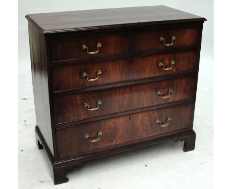 A George III mahogany chest of good colour, the moulded rectangular top above two short and three long drawers raised on brac