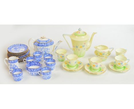 A Grafton part coffee service decorated with grasses and flowers, comprising coffee pot, cream jug and bowl, five cups and sa