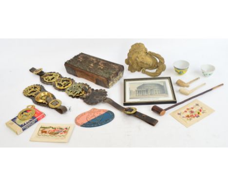 A quantity of collector's items including a door knocker, horse brasses, clay pipes, two Chinese bowls, two silk cards and a 