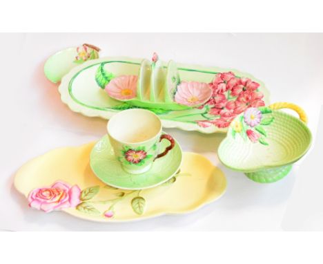 A small collection of Carlton ware comprising a large green ground oval dish, a pear shaped basket, a heart shaped leaf dish,