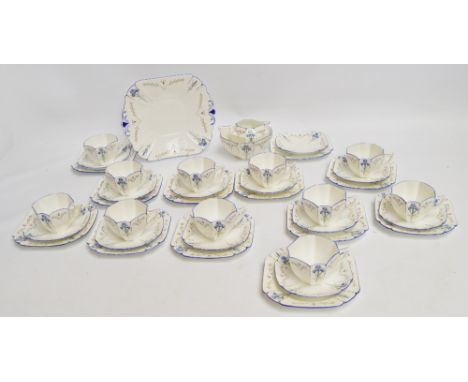 An Art Deco Shelley tea service comprising eleven cups, twelve saucers, twelve side plates, sandwich plate, milk jug and suga