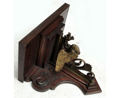 A 19th century carved oak and gilt metal mounted clock bracket, height approx 34cm.