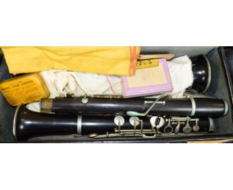 A cased B flat clarinet.