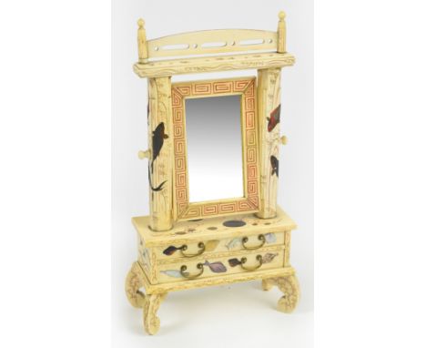 An unusual Japanese Meiji period Shibayama style miniature cheval mirror, the rectangular plate held within a Greek key decor