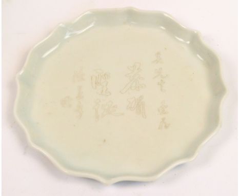 An early 20th century Chinese shaped circular teapot stand with gilded characters, diameter 15.5cm. CONDITION REPORT: Appears