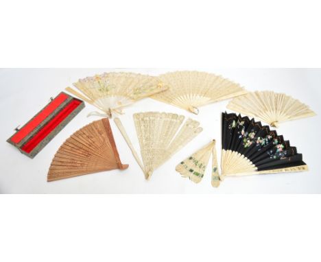 A 19th century Chinese Canton ivory brise fan with twenty-five sticks finely carved and pierced pagodas and floral sprays, le