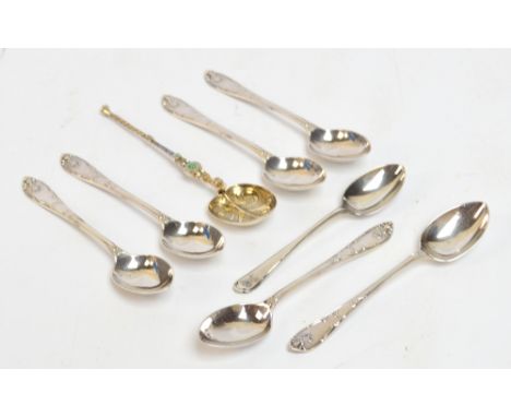 A set of six George V hallmarked silver teaspoons with cast decorated finials, length 18.5cm, Walter Trickett, Sheffield 1922