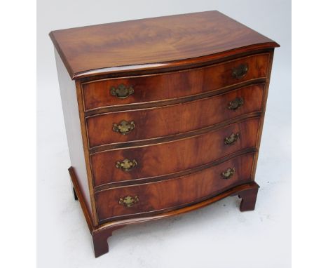 A reproduction mahogany four drawer serpentine chest raised on bracket feet, width 78cm.
