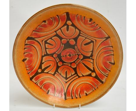 A large Poole pottery bowl in "Aegean" pattern in orange and brown, inscribed to base with dolphin mark and "58", diameter 34