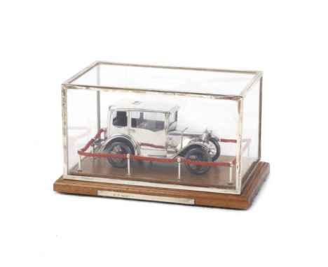 A fine silver model of a 1929 Austin 7 Top Hat Saloon by Gerald Gilbert, London, 1988,1:23 scale, a scratch built engineers' 