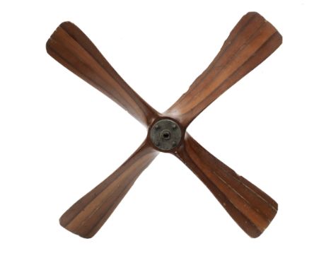 A British World War II era laminated wooden 4 bladed generator propeller, late 1930s-40s, used to power a drogue winch used b