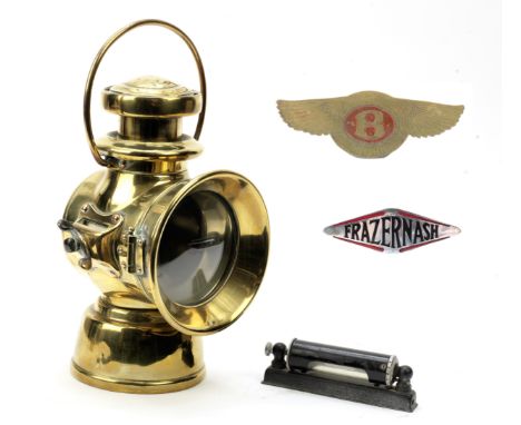 A Lucas No 722 oil illuminated sidelamp,polished brass, with bracket for mounting of left side of car, some denting to rear; 