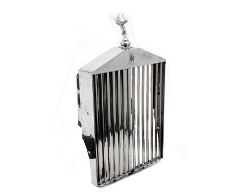A Rolls-Royce Phantom II radiator shell,chromed, complete with shutters and enamel 'RR' badge, some light use, fitted with mo
