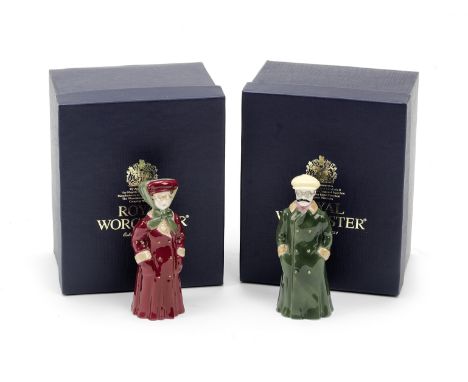 A pair of reproduction glazed ceramic 'The Motorist' candle snuffers by Royal Worcester,modelled as lady and gentleman vetera