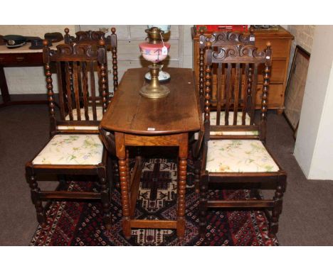 Oak bobbin leg drop leaf dining table and four dining chairs.