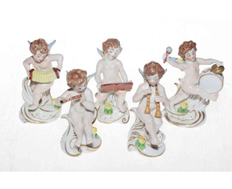 Five Capodimonte cherubs playing instruments, 12cm.