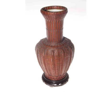 Japanese Ikebana (flower display) vase, of tightly woven smoked split bamboo with ceramic interior, probably Taisho/early Sho