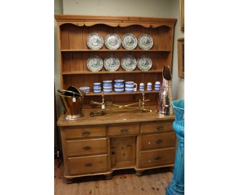 Victorian pine dresser, the shelf back above seven drawers and inset cupboard door, 201cm by 152cm.