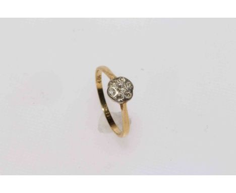 18 carat seven stone diamond cluster ring.