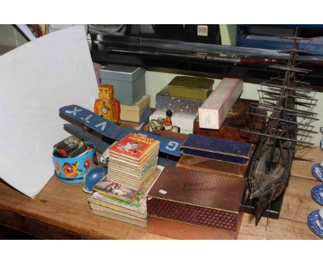 Model galleon, tinplate airplane, robot and drummer on horseback, various boxes, children's books, air rifle and collectables